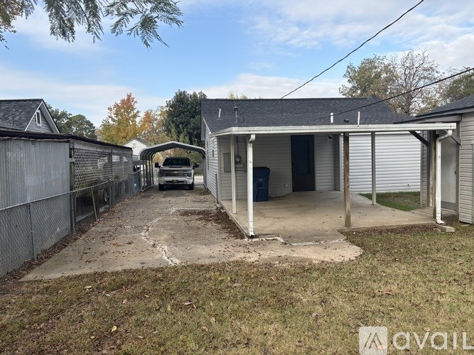 A house with a garage is for sale.
