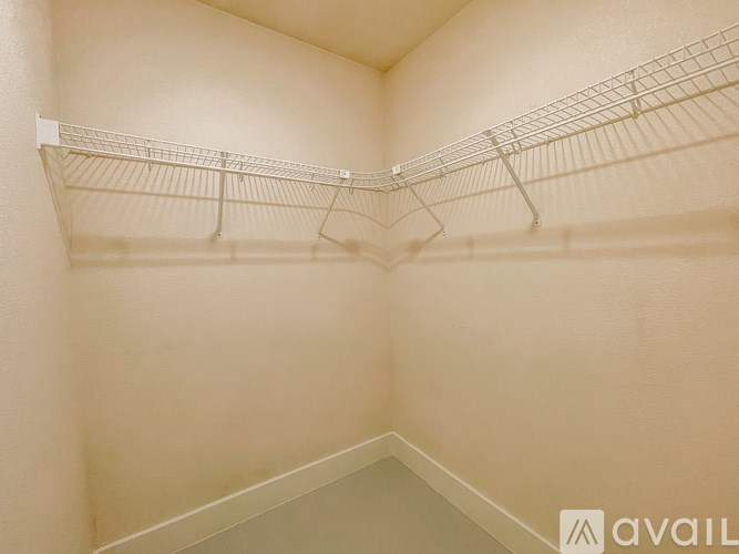 Empty wire shelving in a room.