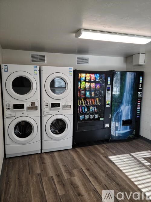 A row of washing machines in a laundromat.