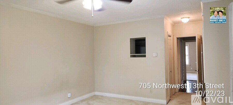 A room with a ceiling fan and a small window is available for rent.