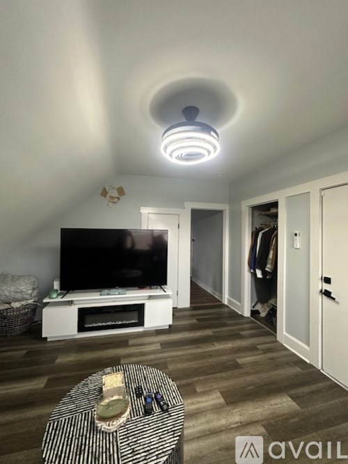 A living room with a television and a coffee table.