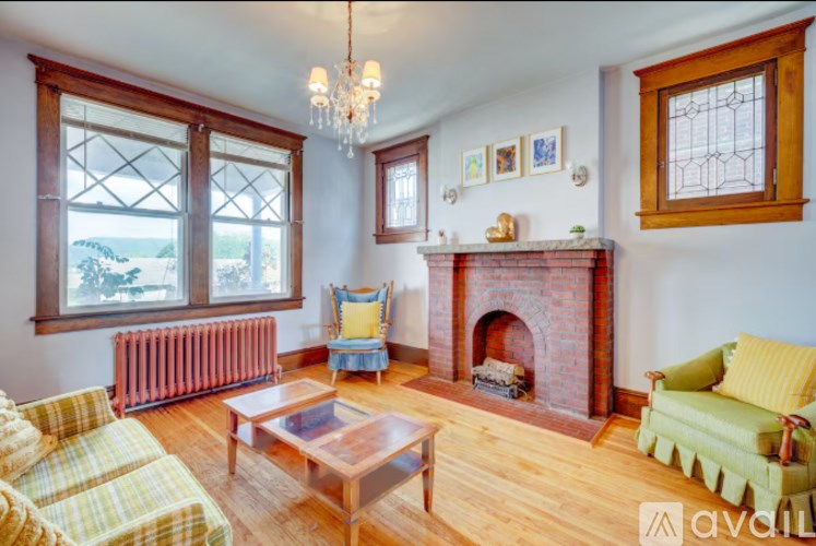 A living room with a fireplace and a couch.