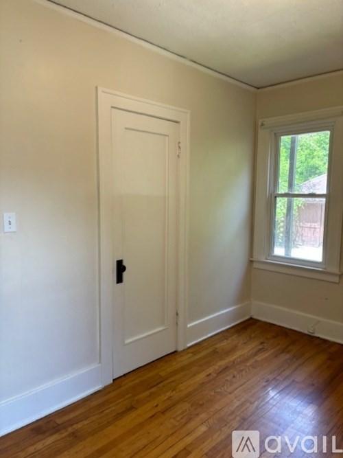 A room with a door and a window.