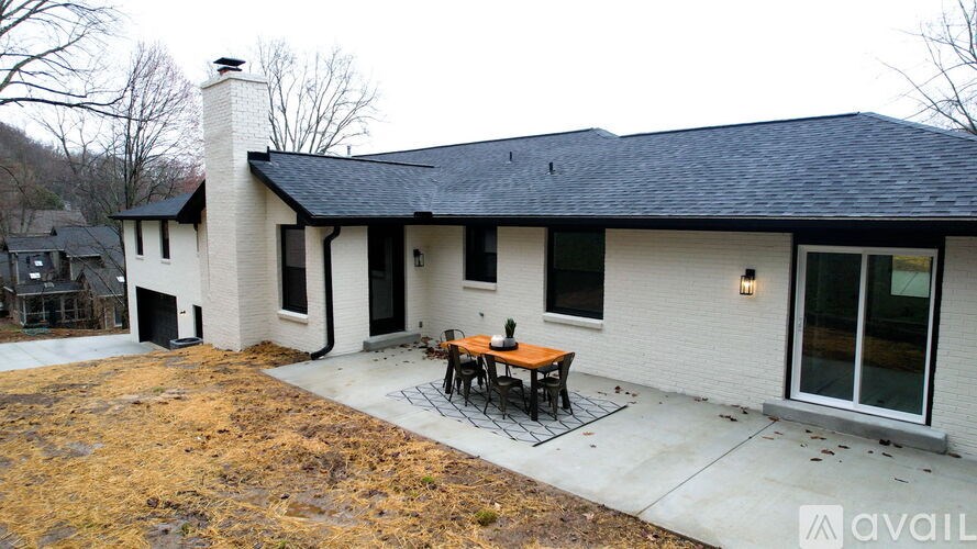A house with a patio and a table.