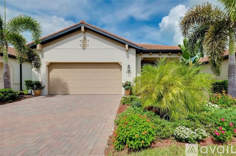 A house with a driveway and a garage door.
