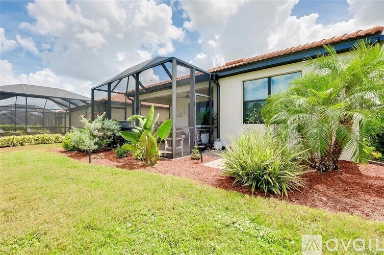 A modern house with a garden in front.