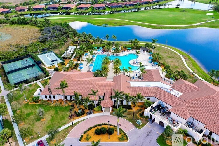 A resort with a pool and tennis courts.