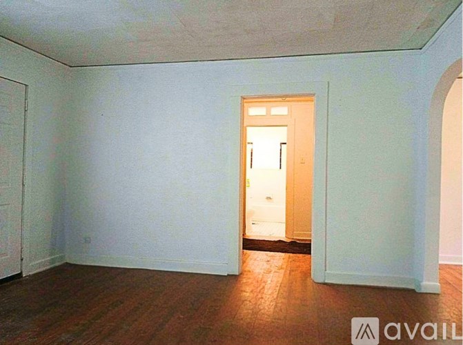 A room with a doorway leading to another room.