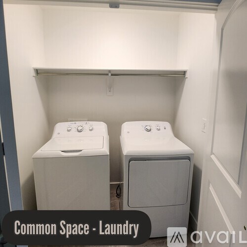 A laundry room with two washing machines.