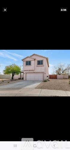 A two-story house with a garage is shown.