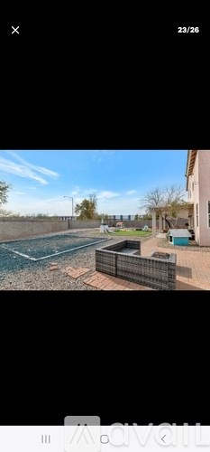 A view of a pool and a fence from a balcony.