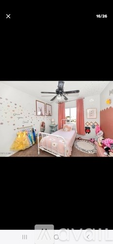 A child's bedroom with a white bed and a ceiling fan.
