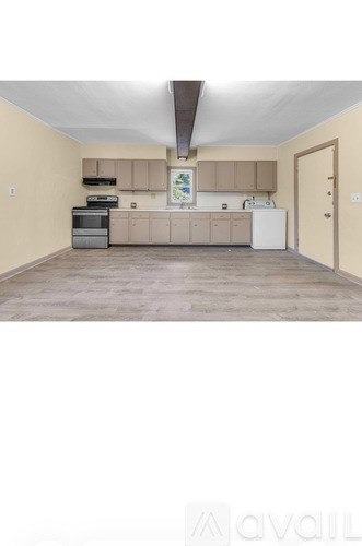 A kitchen with a white fridge and a white oven.