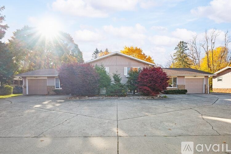 A house with a driveway in front of it is for sale.