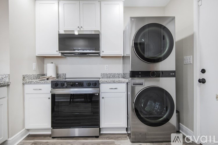 A modern kitchen with a stove, oven, and dishwasher.