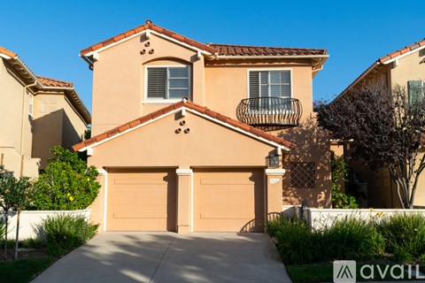 A house with a brown garage door is for sale.