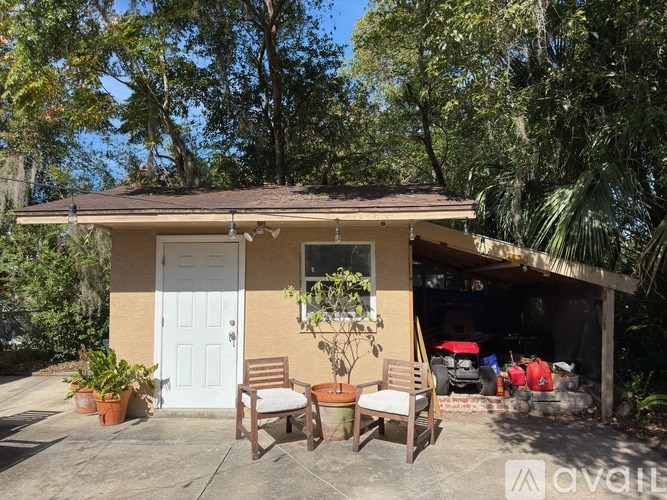 A bird's eye view of a residential area with a blue house in the center.