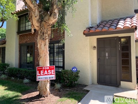 A house with a lease sign in front of it.
