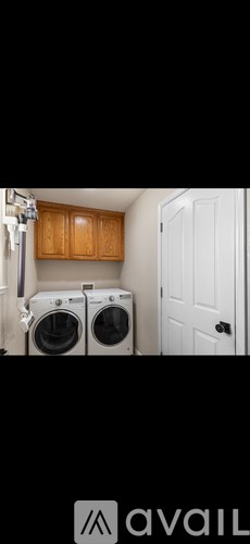 A laundry room with a washer and dryer.