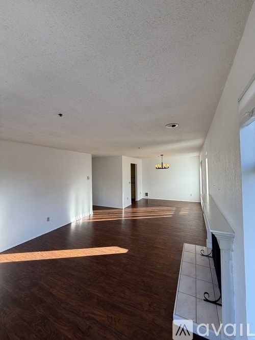 A room with wooden floors and white walls.