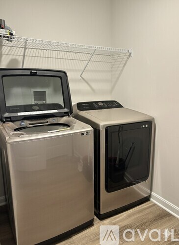 A bathroom with two sinks and a large mirror.