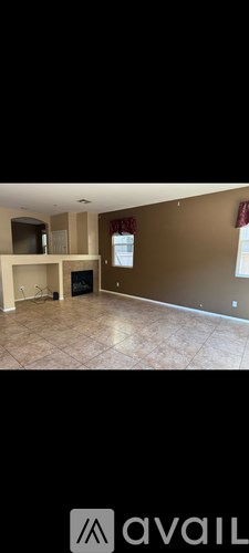 A room with a brown wall and a window.