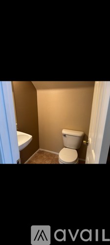 A bathroom with a toilet and a sink.