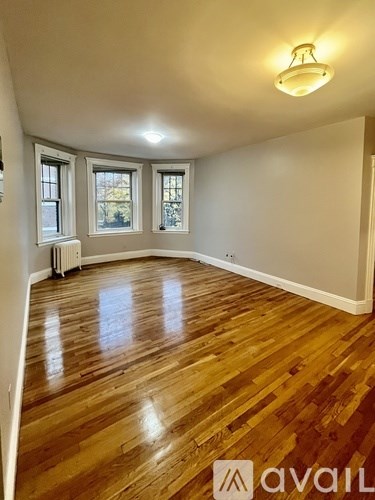 A room with wooden floors and white walls.