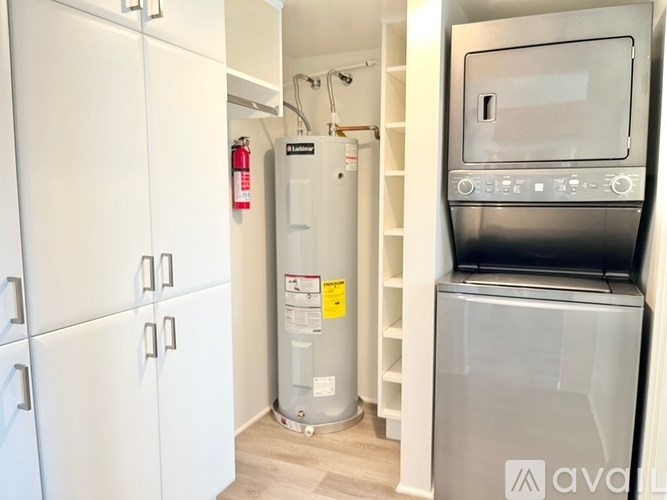 A kitchen with a white fridge, a white oven, and a white microwave.