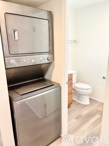 A modern kitchen with a stainless steel oven and dishwasher.