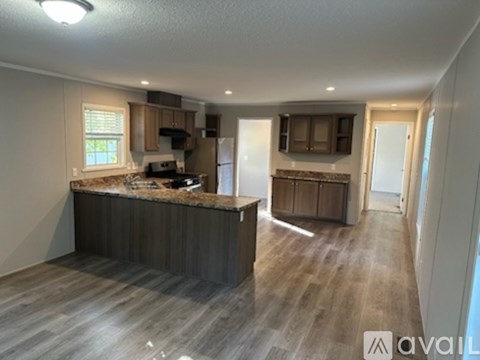 A kitchen with a countertop and cabinets is available for rent.
