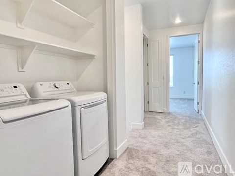 A laundry room with a washer and dryer.