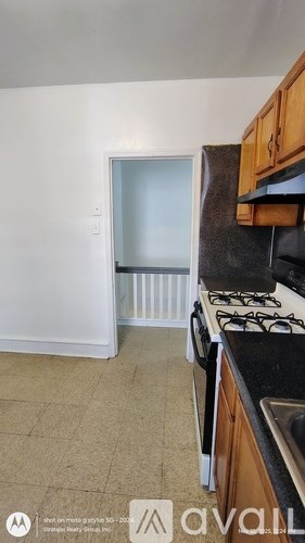 A kitchen with a stove and a window.