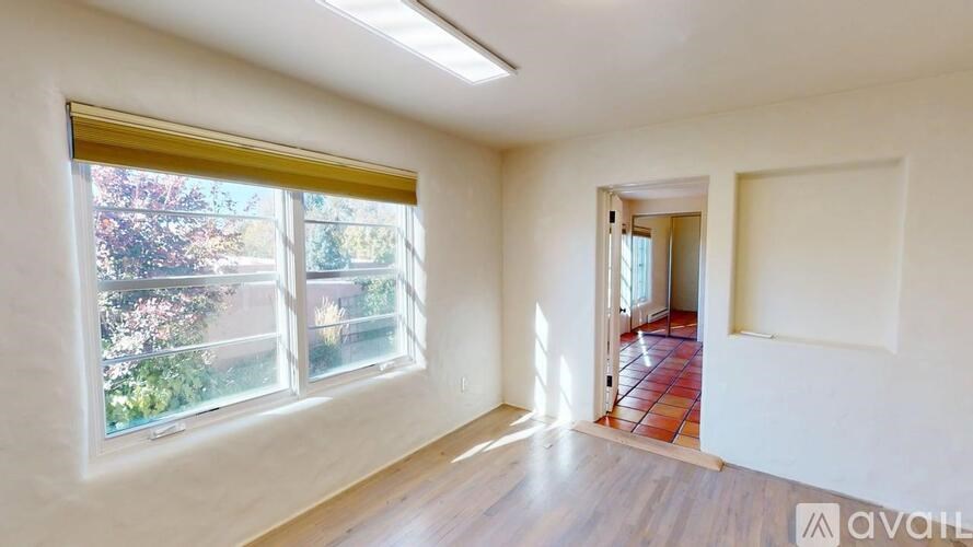 A room with a window overlooking a garden is available for rent.