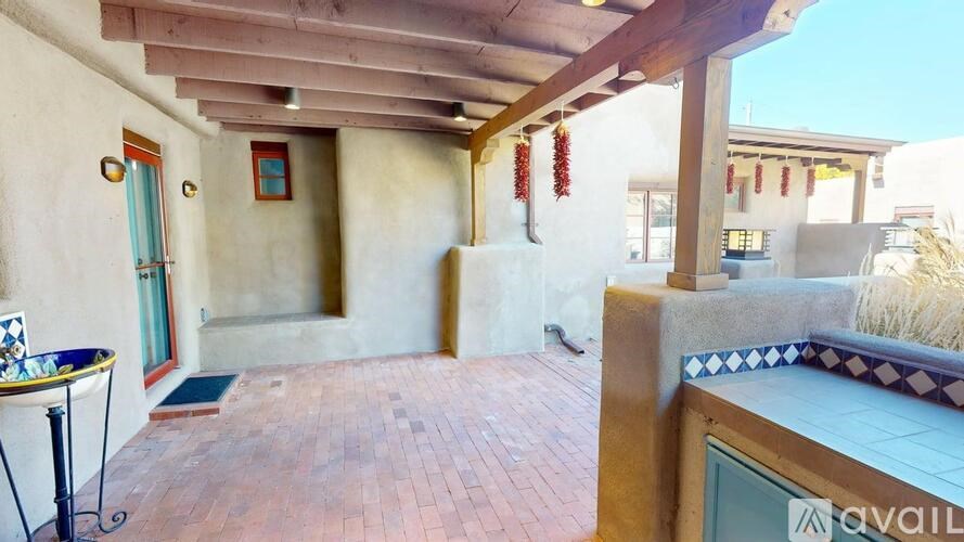 A patio area with a table and chairs is available for rent.