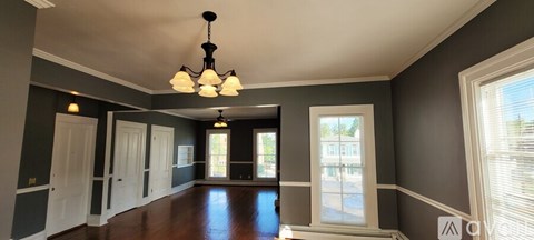 A large room with a chandelier hanging from the ceiling.
