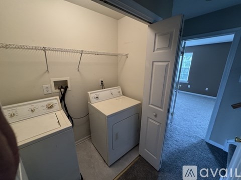 A laundry room with a washer and dryer.