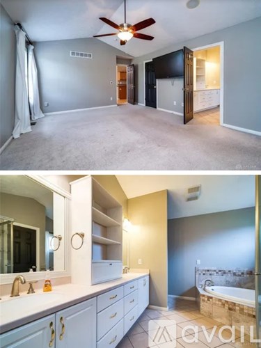 A well-lit, spacious room with a ceiling fan and a bathroom with a tub and a sink.