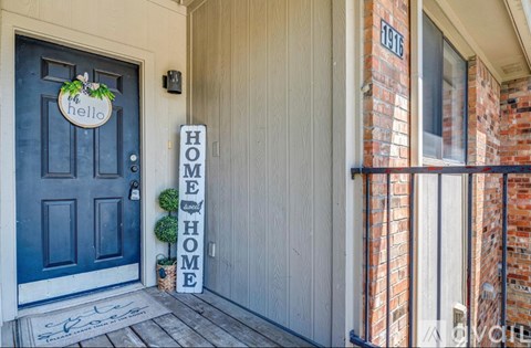 A blue door with a sign that says "Hello" on it.