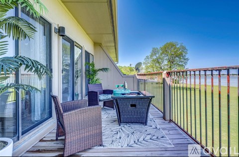 A patio with a table and chairs is shown.