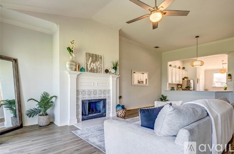 A living room with a fireplace and a couch.