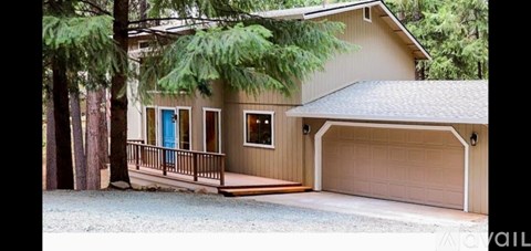 A house with a blue door and a garage.
