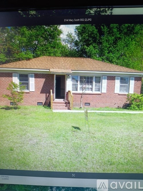 A house with a brown roof and a white door.