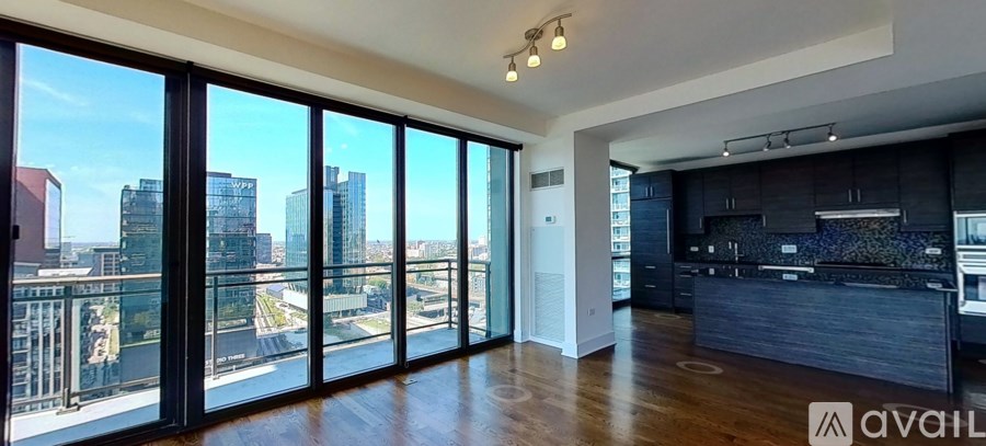 A spacious, modern kitchen with a view of the city.