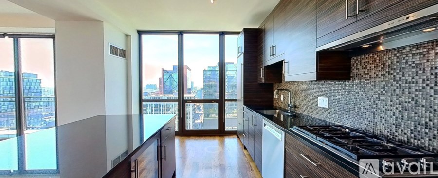 A modern kitchen with a view of the city.