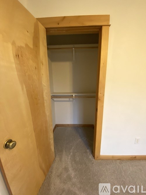 A room with a door and a wall.