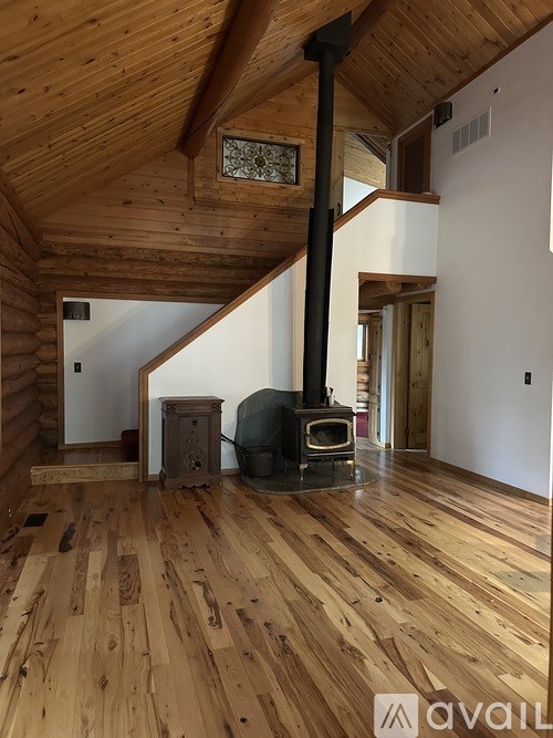A wood burning stove in a log cabin.