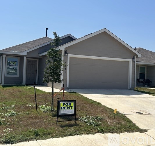 A house with a garage is for rent.