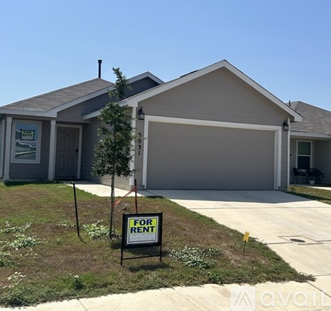 A house with a garage is for rent.