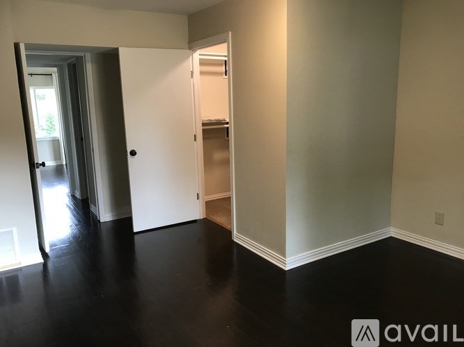 A room with a black floor and white walls.